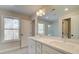 Bathroom featuring double sinks, a vanity, and natural light at 4517 Twinberry Dr, Powder Springs, GA 30127