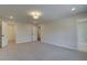 Spacious bedroom featuring a carpet, and doors to the bathroom and closet at 4517 Twinberry Dr, Powder Springs, GA 30127