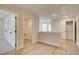 Hallway with hardwood floors, open doors to rooms, and a closet at 4517 Twinberry Dr, Powder Springs, GA 30127