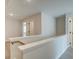 Upstairs hallway features a wood banister and connects to the bedrooms at 4517 Twinberry Dr, Powder Springs, GA 30127