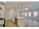 Open concept kitchen with a spacious island, stainless steel appliances, and ample natural light at 4517 Twinberry Dr, Powder Springs, GA 30127