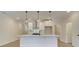Contemporary kitchen featuring a large island, designer lighting, and stainless steel hood at 4517 Twinberry Dr, Powder Springs, GA 30127
