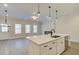 Modern kitchen with a large island, stainless steel appliances, and an open floor plan at 4517 Twinberry Dr, Powder Springs, GA 30127