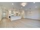 Open-concept living space featuring a modern kitchen, spacious area, and lots of natural light at 4517 Twinberry Dr, Powder Springs, GA 30127