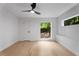 Bedroom featuring hardwood floors, a modern ceiling fan, and ample natural light at 5020 Vallo Vista Ct, Atlanta, GA 30342