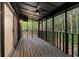 Outdoor deck with natural wood floors and views of the surrounding greenery at 5020 Vallo Vista Ct, Atlanta, GA 30342