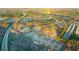 Aerial view of a residential community surrounded by nature, featuring a pond and a nearby highway at 553 Princeton Elm Place Way, Lawrenceville, GA 30045