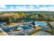 Community aerial view showcasing tennis courts, pool, clubhouse, playgrounds, and new landscaping at 553 Princeton Elm Place Way, Lawrenceville, GA 30045