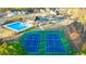 Aerial view of community amenities including a pool, tennis courts, playground, and clubhouse at 553 Princeton Elm Place Way, Lawrenceville, GA 30045