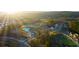 Aerial view showcasing community amenities, including a pool, clubhouse, and landscaped green spaces at 553 Princeton Elm Place Way, Lawrenceville, GA 30045