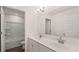 Well-lit bathroom features a double sink vanity with white cabinets and a separate toilet and shower area at 553 Princeton Elm Place Way, Lawrenceville, GA 30045