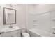 Bathroom featuring a vanity sink, toilet, and bathtub with shower at 553 Princeton Elm Place Way, Lawrenceville, GA 30045
