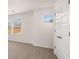Bright bedroom featuring carpet, windows, and a closet at 553 Princeton Elm Place Way, Lawrenceville, GA 30045