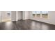 Bedroom featuring hardwood floors, lots of light, and walk-in closet at 553 Princeton Elm Place Way, Lawrenceville, GA 30045