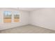 Bright bedroom featuring carpet and a window at 553 Princeton Elm Place Way, Lawrenceville, GA 30045