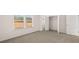 Bedroom featuring carpet, windows, and a closet at 553 Princeton Elm Place Way, Lawrenceville, GA 30045
