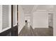 View of the home's foyer with hardwood floors, white trim, and an open floor plan at 553 Princeton Elm Place Way, Lawrenceville, GA 30045