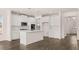 This open kitchen features modern appliances, an island with a sink, and plenty of cabinet space at 553 Princeton Elm Place Way, Lawrenceville, GA 30045