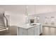 This open kitchen features a large island and modern appliances, with seamless access to the dining and living areas at 553 Princeton Elm Place Way, Lawrenceville, GA 30045