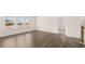 Open-concept living room featuring hardwood floors and ample natural light at 553 Princeton Elm Place Way, Lawrenceville, GA 30045