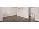 Bright, open living room features hardwood floors and plenty of natural light at 553 Princeton Elm Place Way, Lawrenceville, GA 30045
