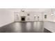 Spacious living room with hardwood flooring, stone fireplace, and great natural light at 553 Princeton Elm Place Way, Lawrenceville, GA 30045