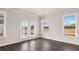 Open living area features hardwood floors, lots of natural light and backyard views at 553 Princeton Elm Place Way, Lawrenceville, GA 30045