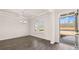 Bright, open living room with hardwood floors, a modern chandelier, and an abundance of natural light at 553 Princeton Elm Place Way, Lawrenceville, GA 30045