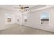 Spacious main bedroom with multiple windows and a ceiling fan at 553 Princeton Elm Place Way, Lawrenceville, GA 30045
