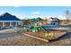 Community playground with slides and climbing structures, set in a landscaped, mulched area at 553 Princeton Elm Place Way, Lawrenceville, GA 30045