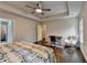 Bedroom features a desk and chair area with an area rug, and a ceiling fan at 6468 Pierless Ave, Sugar Hill, GA 30518