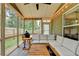 Comfortable screened porch with outdoor dining area, perfect for entertaining at 6468 Pierless Ave, Sugar Hill, GA 30518