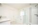 Bright bathroom featuring a separate glass shower, tub, and double sink vanity at 875 Venture Sw Way, Atlanta, GA 30331