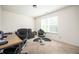 Bedroom with a couch, desk, barber's chair and window, perfect for an office, studio, or personal retreat at 875 Venture Sw Way, Atlanta, GA 30331