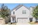 Two-story home with a two-car garage, landscaped front yard and traditional architecture at 875 Venture Sw Way, Atlanta, GA 30331
