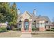 Elegant house with a well-manicured lawn, landscaped bushes and mature trees at 875 Venture Sw Way, Atlanta, GA 30331