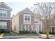Charming two-story home with gray siding, brick accents, a cozy balcony, and well-maintained landscaping at 875 Venture Sw Way, Atlanta, GA 30331