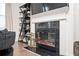 Close-up of a fireplace with black marble and white trim, flanked by display shelves with decorative items at 875 Venture Sw Way, Atlanta, GA 30331