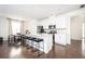 Modern kitchen featuring stainless steel appliances, a center island with bar seating, and dark hardwood flooring at 875 Venture Sw Way, Atlanta, GA 30331