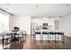 Bright, open kitchen with white cabinetry, a large island with seating, and modern stainless steel appliances at 875 Venture Sw Way, Atlanta, GA 30331