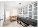 Bright office space with frosted glass closet, sofa, carpet and a modern desk perfect for work or relaxation at 875 Venture Sw Way, Atlanta, GA 30331