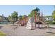 Community playground with slides, climbing structures, and benches for parents to watch their  at 875 Venture Sw Way, Atlanta, GA 30331