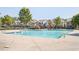 Large community pool surrounded by meticulously kept landscaping and multiple unit homes at 875 Venture Sw Way, Atlanta, GA 30331