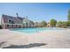 Large community pool surrounded by a pool deck, clubhouse and plenty of space for relaxation at 875 Venture Sw Way, Atlanta, GA 30331