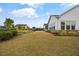 Large backyard featuring a dining area and landscaped bushes and trees at 170 Oakleigh Manor Dr, Fayetteville, GA 30215