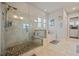 Relaxing bathroom with glass shower, soaking tub, and natural stone details at 170 Oakleigh Manor Dr, Fayetteville, GA 30215