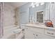 Bathroom featuring granite countertops, stainless fixtures, and a tub shower combo at 170 Oakleigh Manor Dr, Fayetteville, GA 30215