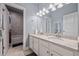 Bathroom featuring double sinks, a stone countertop, and a shower-tub combination at 170 Oakleigh Manor Dr, Fayetteville, GA 30215