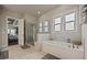 Lovely bathroom featuring a glass shower and large tub with tiled floors at 170 Oakleigh Manor Dr, Fayetteville, GA 30215