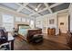 Spacious bedroom with tray ceiling, hardwood floors and natural light at 170 Oakleigh Manor Dr, Fayetteville, GA 30215